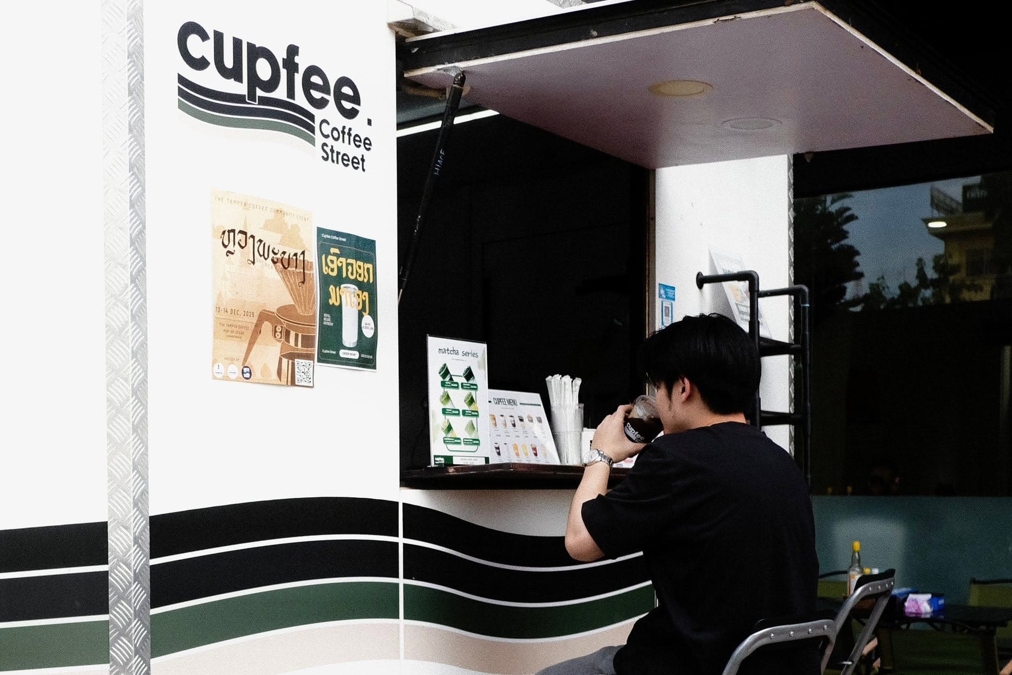 Customer enjoying coffee at the Cupfee counter