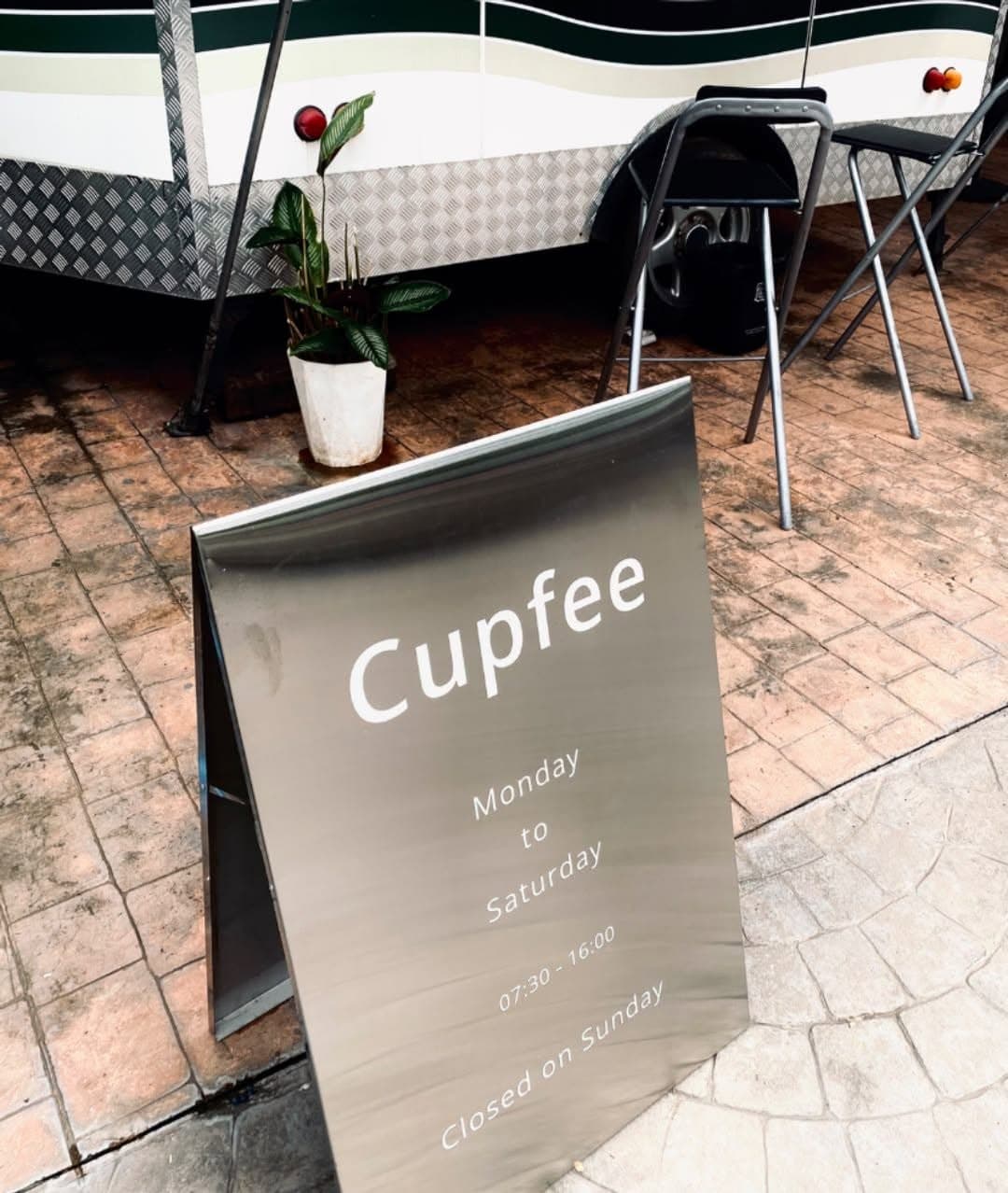 Cupfee street sign and outdoor seating